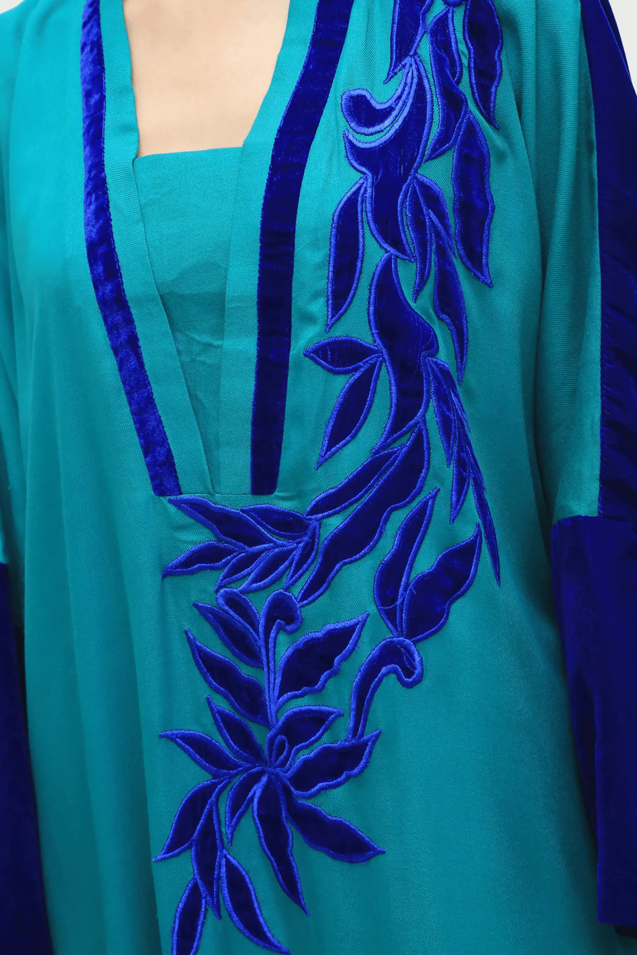 Teal and navy marina suit with velvet sleeves and applique work