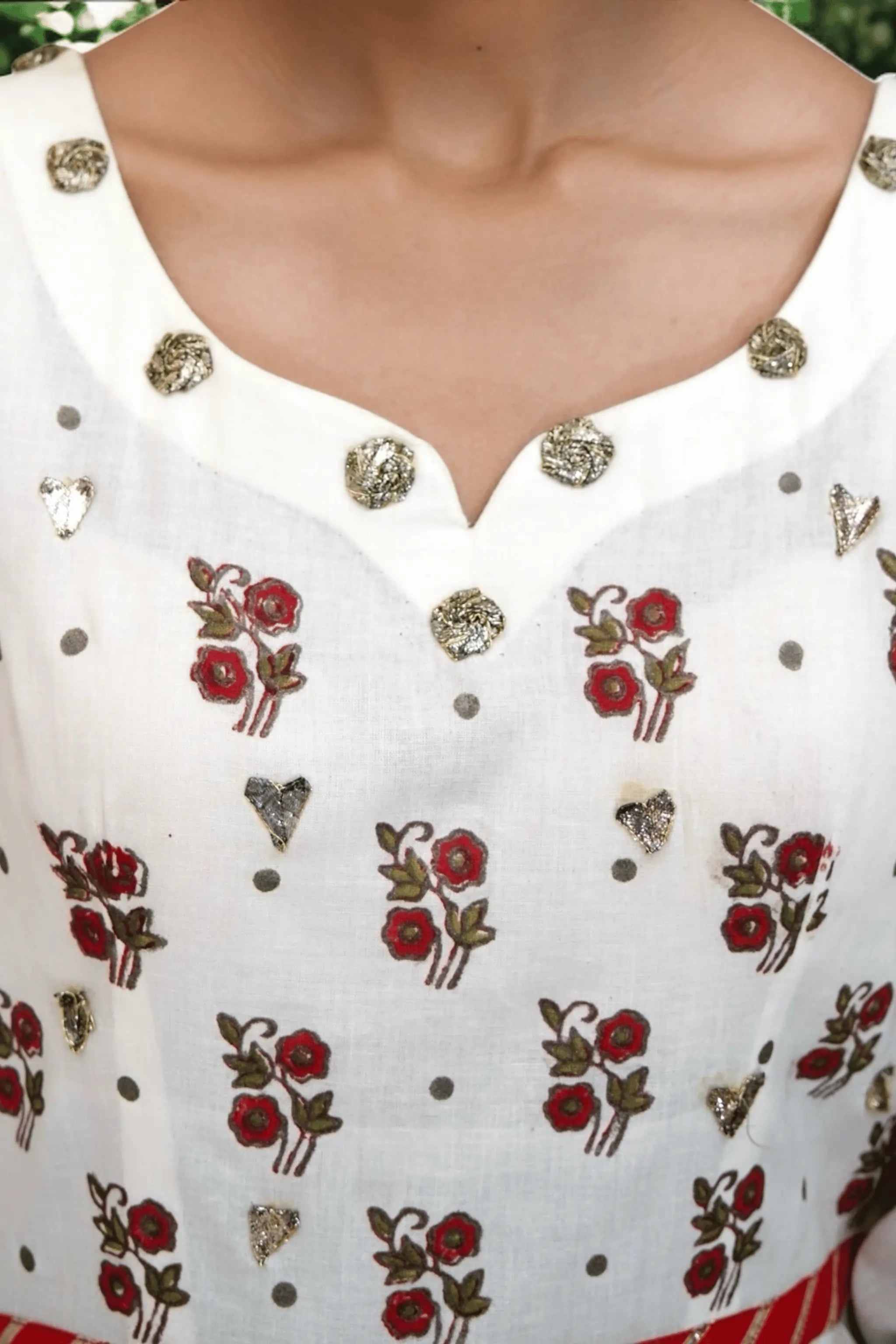 Gulzaar – block print detailing on off-white & red flared frock — close-up