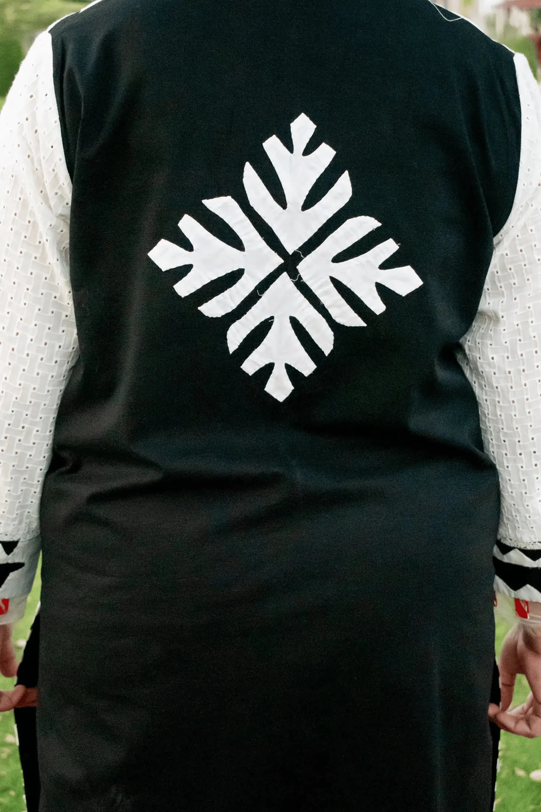 Back view of Aztec shirt with ralli motif design.