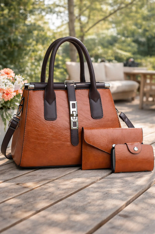 Brown structured PU leather women’s handbag set with top handles, shoulder strap, clutch, and coin pouch placed on a wooden table in a daylight outdoor setting