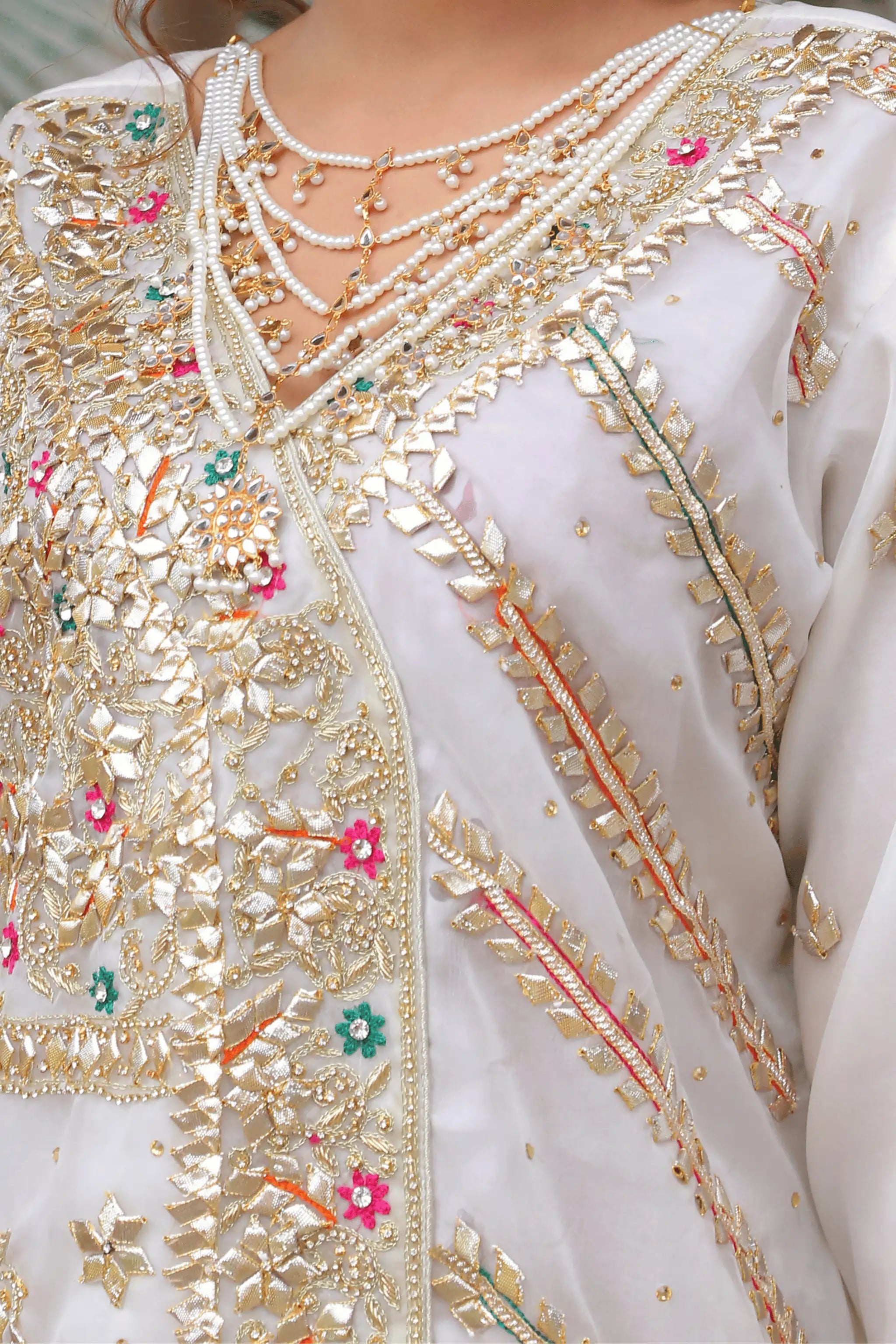 Close-up embroidery detail of Zareen festive organza shirt