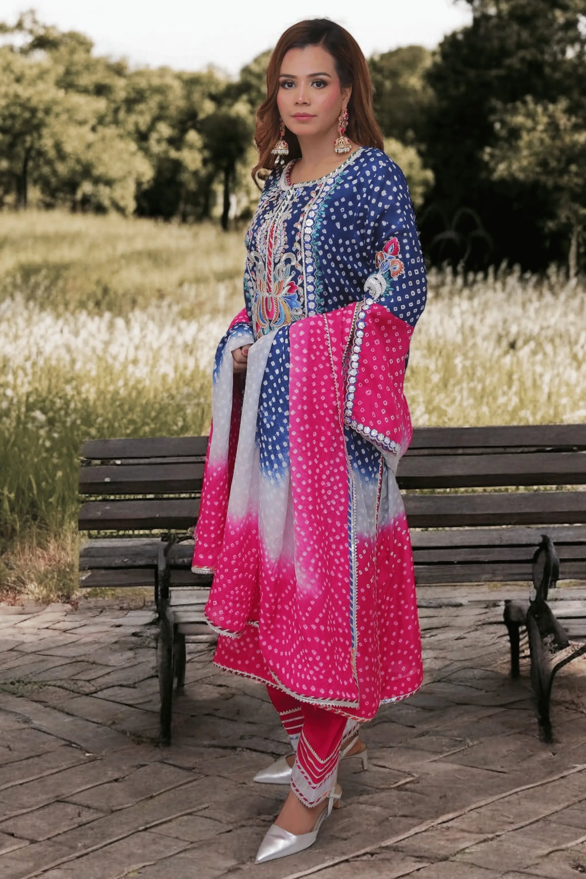 Close-up of chunri thread embroidery and bead embellishments.