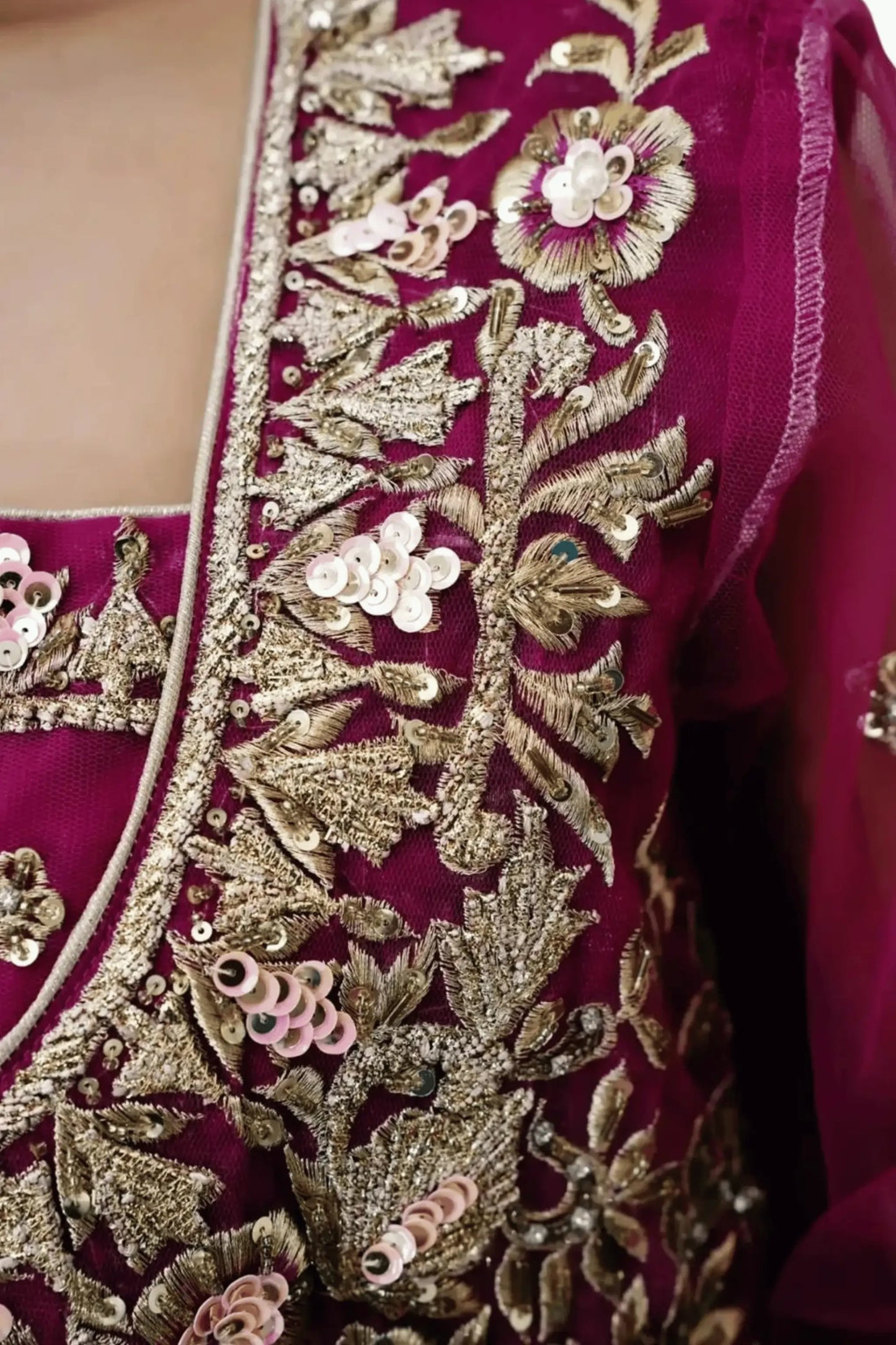 Close view of premium raw silk fabric with dense sequin and zari work