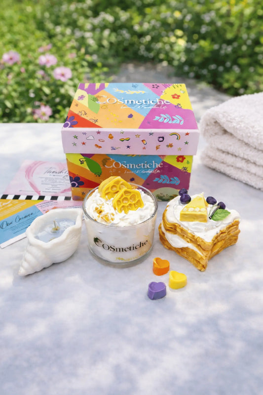 Cosmetiche Baking Festive Bundle scented candles featuring honey cheese, bread and butter, and beach breeze fragrances in a festive gift set.