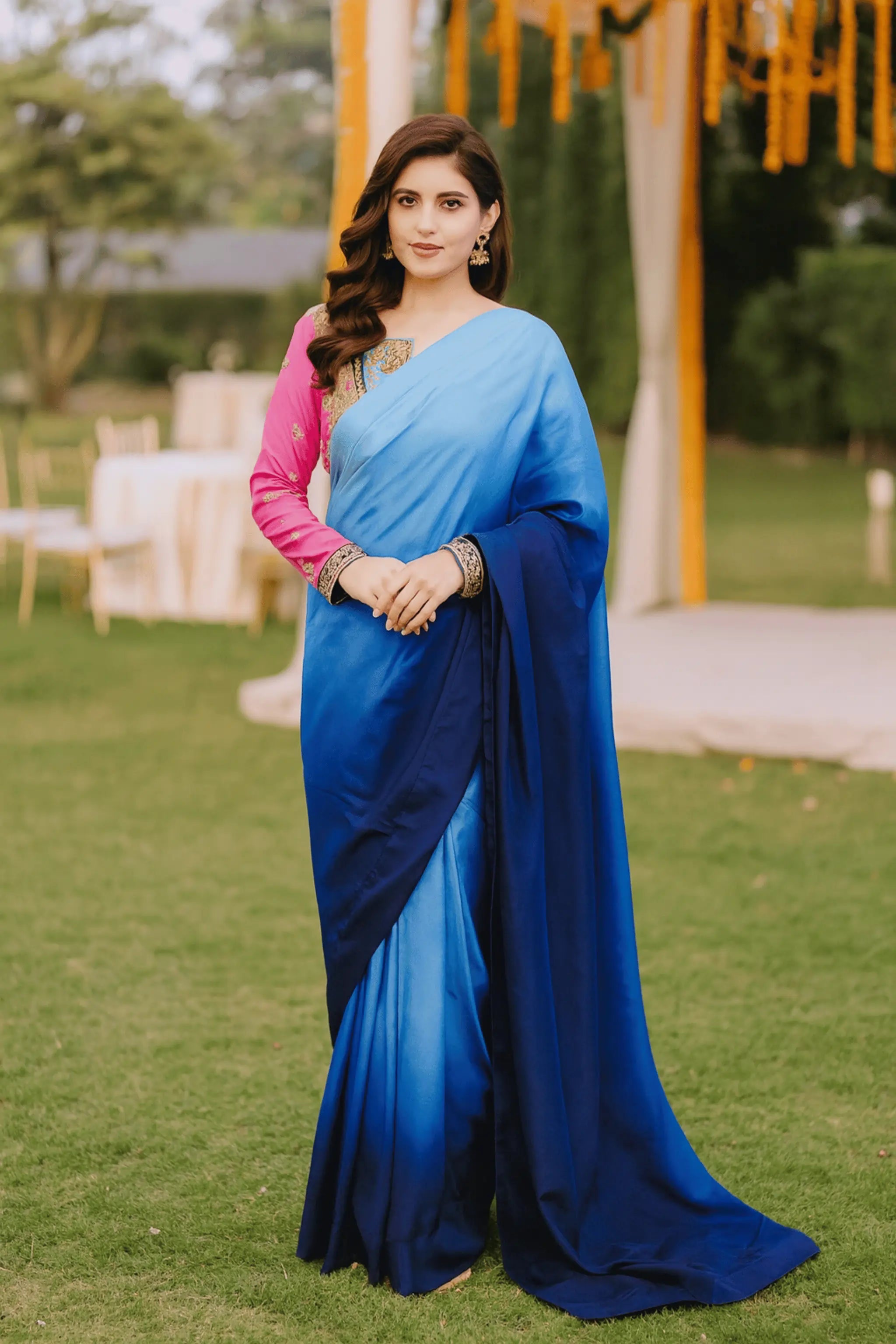 Full view of Whisper Korean silk saree draped elegantly, styled with embroidered raw silk blouse in pink and blue