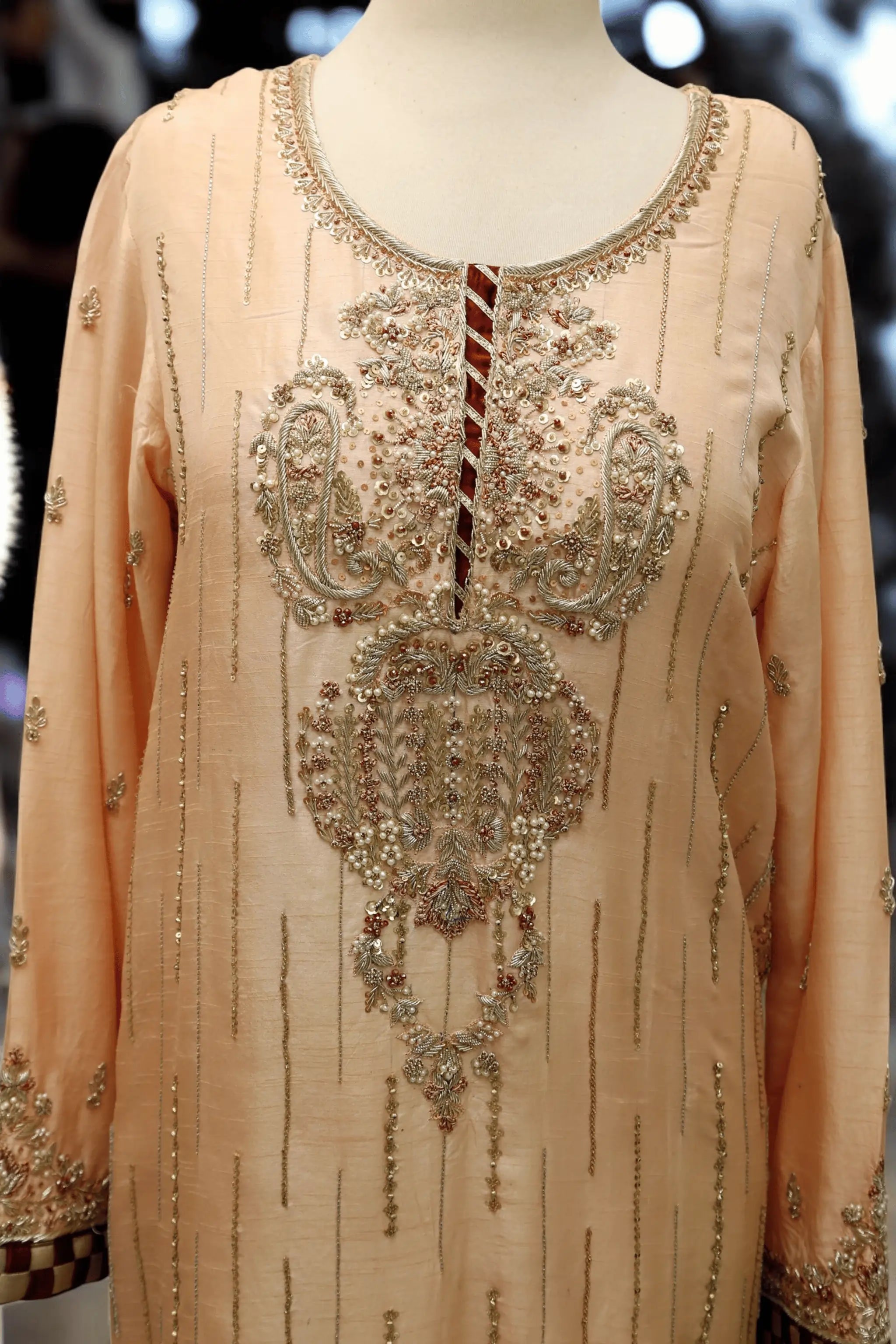 Handcrafted embroidery with pearls, sequins, and thread work