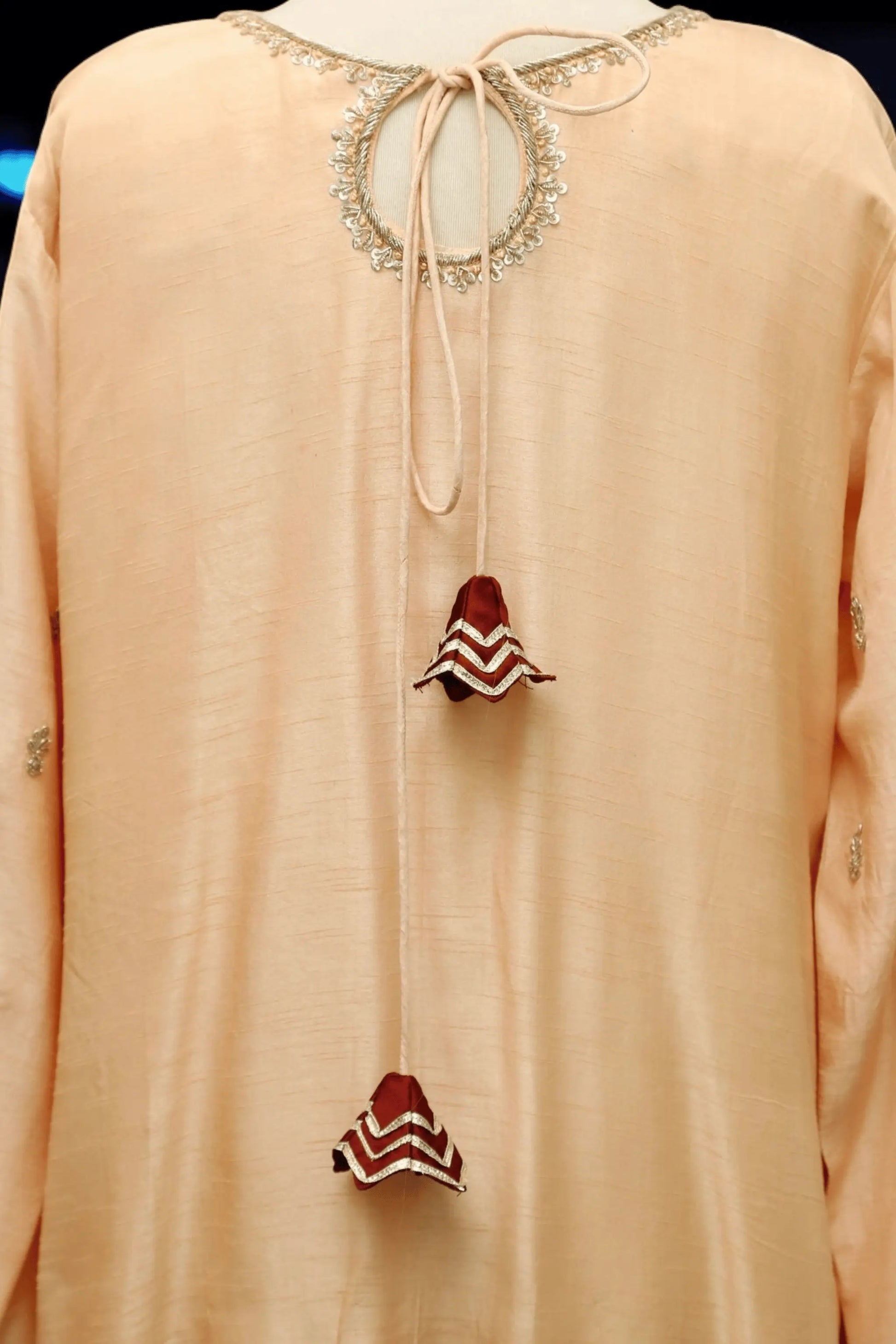 Handcrafted embroidery with pearls, sequins, and thread work