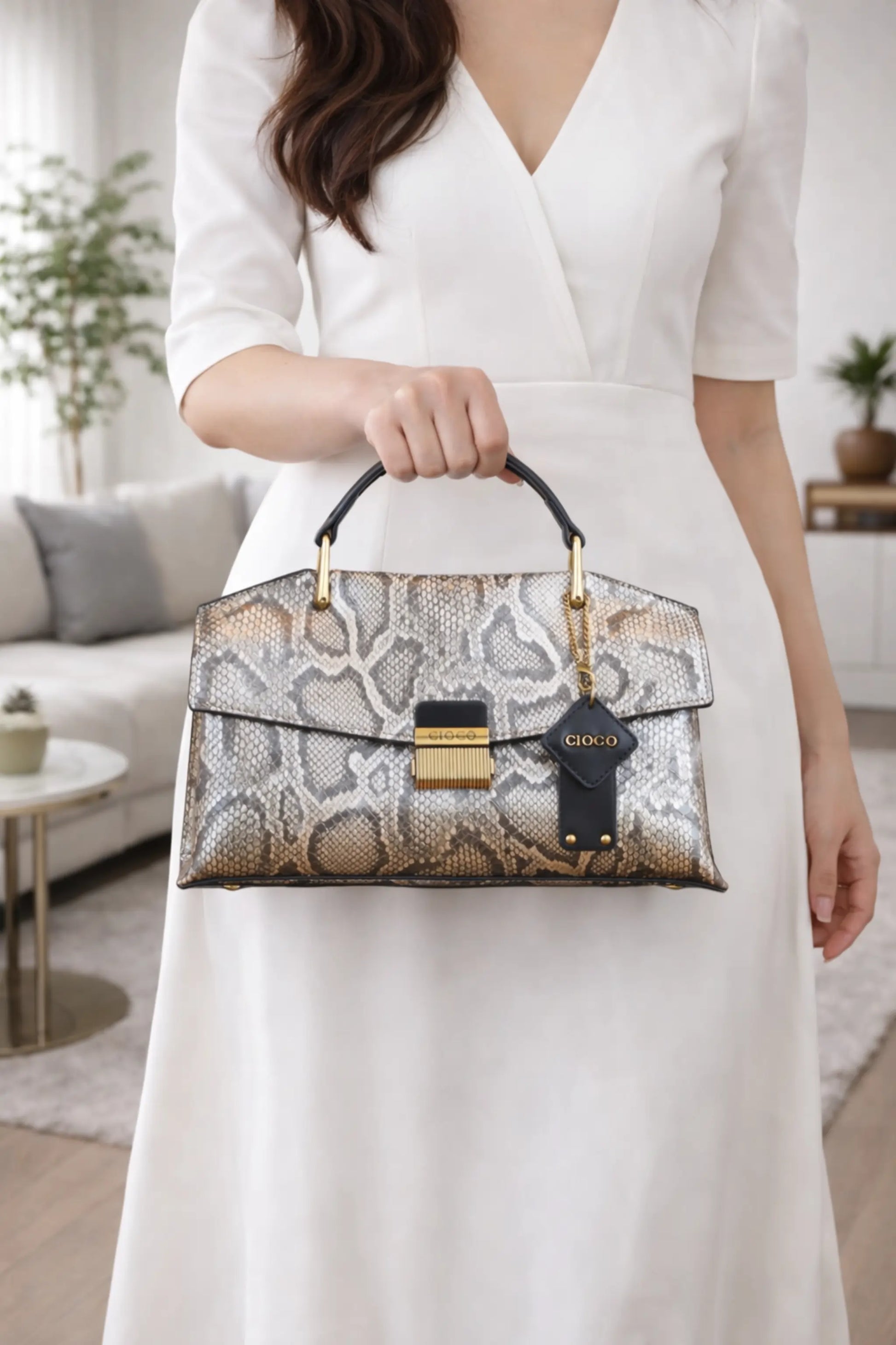 High-end women’s shoulder handbag in vintage blue snakeskin texture, featuring a top handle design and spacious interior for daily use.