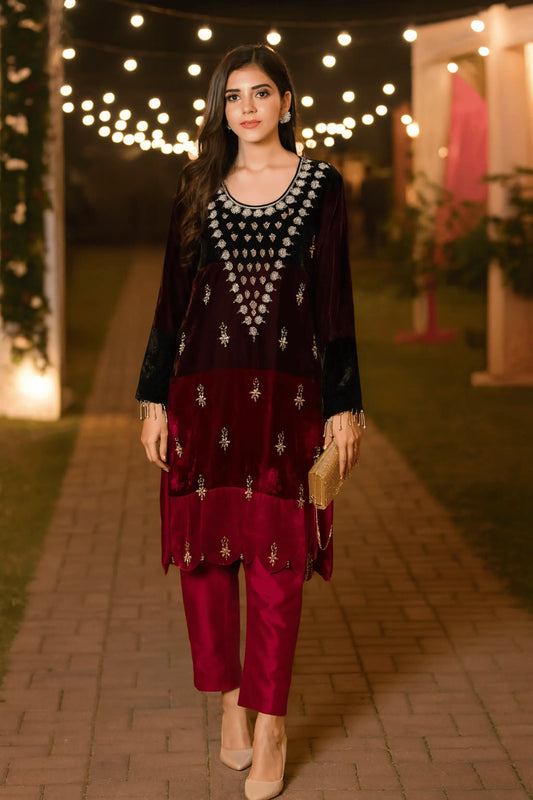Model wearing Royal Maroon Velvet embroidered 3-piece suit with organza dupatta.