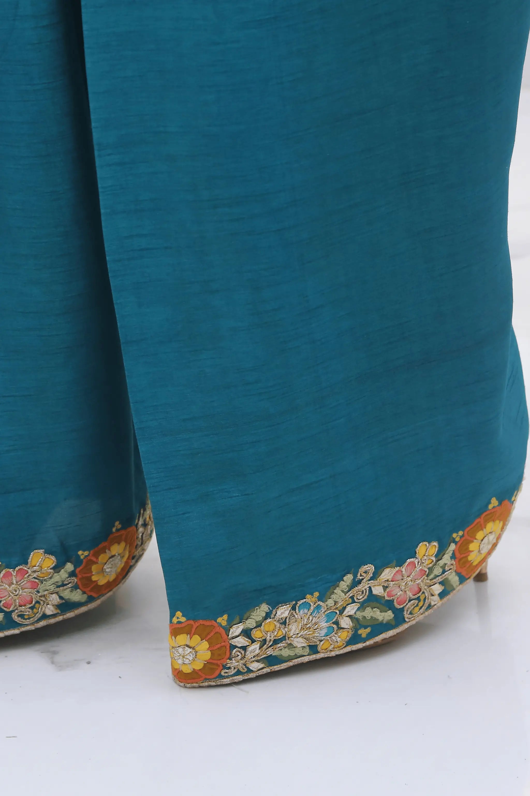 Raw silk farshi shalwar with embroidered hem.